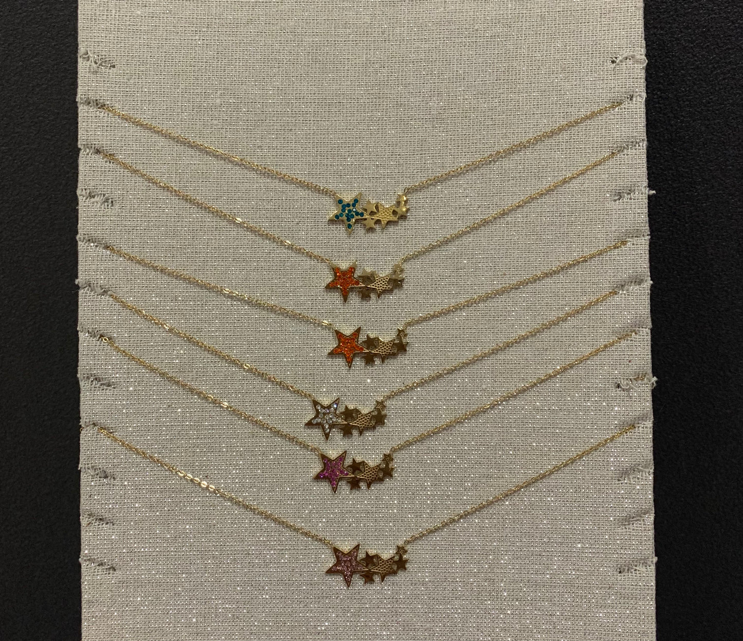 Collier acier trio d’étoiles doré